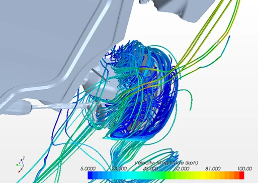 Airflow simulation around a vehicle wheel assembly, showing swirling streamlines and velocity magnitude with a color scale from blue (low speed) to red (high speed).