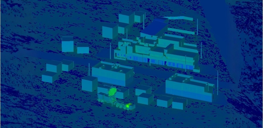 Thermal simulation of a building complex showing temperature distribution across structures and surrounding environment.