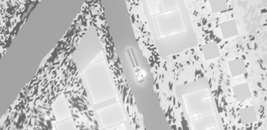 Top-down simulation view of a vehicle moving through an urban area, showing environmental or thermal distribution across buildings and terrain.