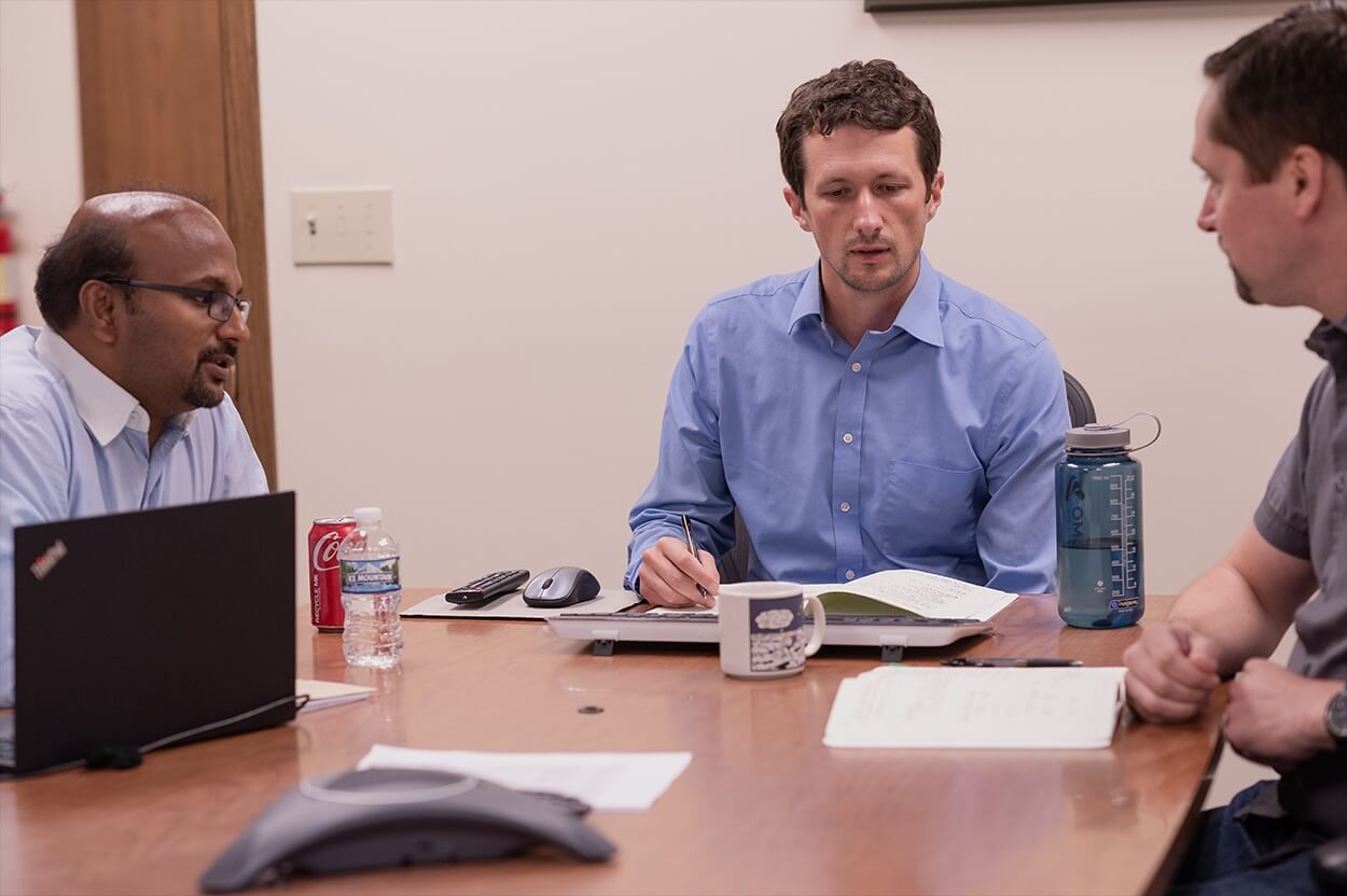 People working at a conference table