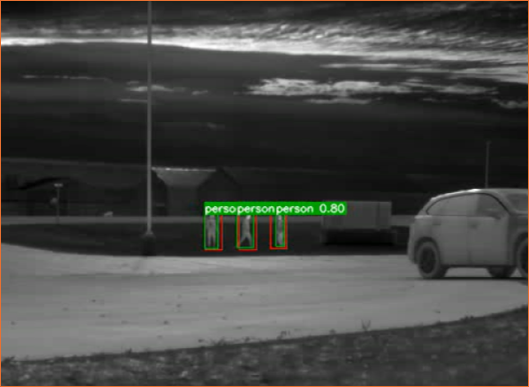 Automated Target Recognition system output showing humans identified with confidence scores on an infrared image
